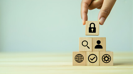 Building a Secure Future Hand places padlock block on business icon stack, symbolizing robust cybersecurity, data protection, and information privacy management