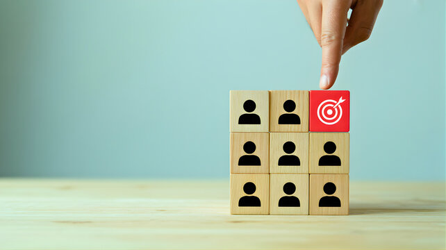 Selecting the ideal candidate by targeting the right person from a group of potential employees with a bullseye icon