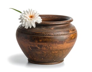 A rustic, earthen-toned pot with a white flower nestled within, casting a shadow on a white background