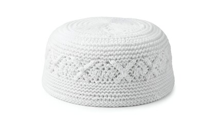 Knitted white prayer cap with intricate texture and peci design displayed on a clean background