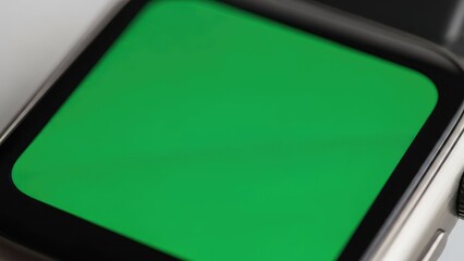 Green screen on a smartwatch display.