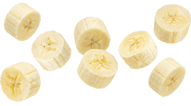 healthy banana slices artfully arranged in a scattered pattern, showcasing their vibrant yellow color and fresh texture against a clean transparent background.