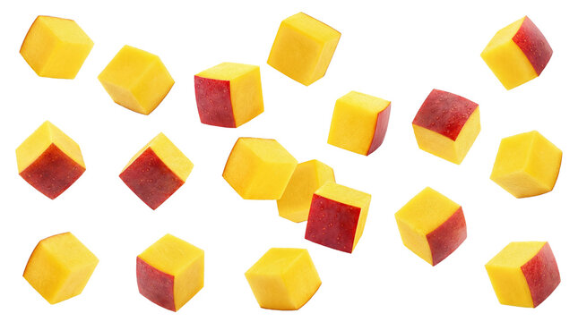 close-up photograph of precisely cut mango cubes with distinct red peel segments, artfully scattered against a deep transparent background, conveying freshness and vibrant flavor.
