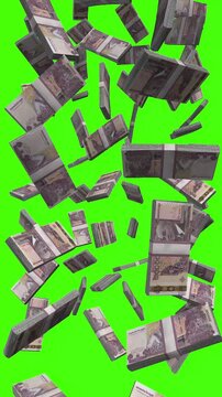 Vertical Cambodian Riel bills falling on chromakey, KHR cash rain
