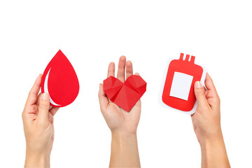 Hands hold red paper cutouts: droplet, heart, bag, isolated, PNG