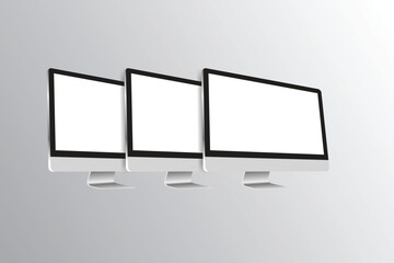 Modern computer monitors with blank white screens for displaying digital content and mockups