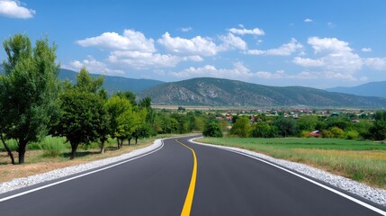 Fototapeta premium Serene Scenic Road Winding Through Lush Green Fields and Vibrant Countryside Under a Bright Blue Sky with Fluffy Clouds and Majestic Mountains in Background