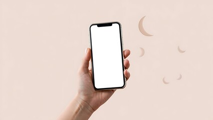 Hand holding a smartphone with a blank white screen against a soft pink background.