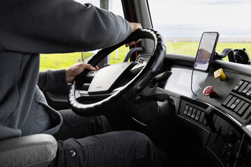 Driving a truck on a long haul route in Pleasant Grove, California by a long haul truck driver during daylight hours while handling the steering wheel