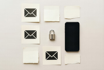 Smartphone security concept with padlock and envelope icons on paper notes