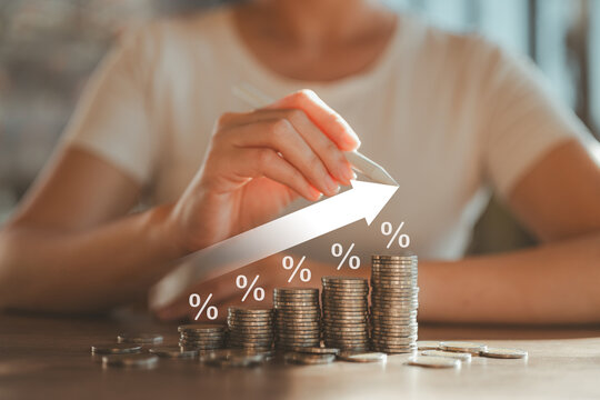 Savings dividend percentage. Financial planning concepts. Interest dividends from fixed deposits. Financial insurance premiums. Retirement money. Results of bracelets from investing in stocks.