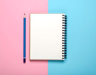 A flat lay showcases a blue pencil placed beside an open, spiral-bound notebook on a two-tone pink and blue surface