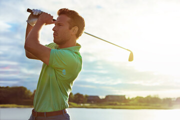 Outdoor, practice and man with golf club, swing and nature for match, sunrise and skill development. Athlete, active and person with technique for sport competition, space and getting ready for game