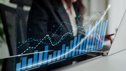 A focused businesswoman analyzes financial growth trends with digital graphs and charts displayed on her laptop in a contemporary office space, emphasizing data-driven decision making. Copula - Powered by Adobe