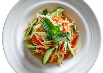 Salad with carrot, cucumber, and mint on a white plate, viewed from overhead