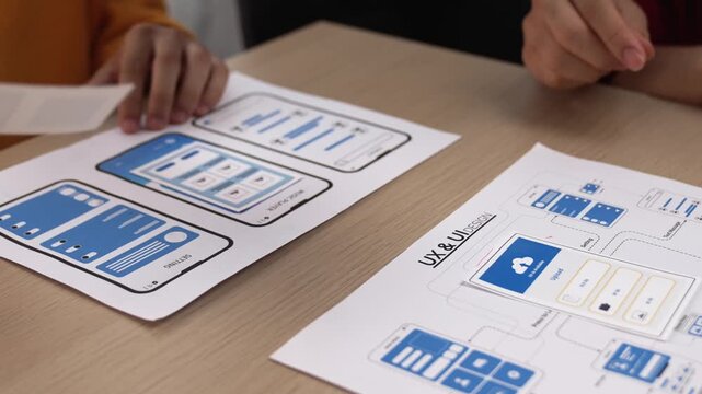 Panorama video of startup company employee planning on user interface prototype for mobile application or website in office. UX UI designer brainstorm designing user friendly interface plan. Synergic