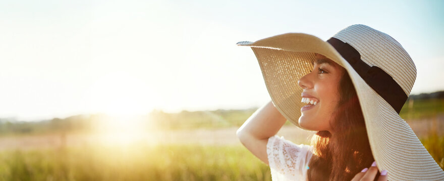 Thinking, woman and sunhat for travel in nature for fresh air, happy memory and summer holiday. Space, female person and banner with sunshine, calm morning and vacation trip with smile in countryside