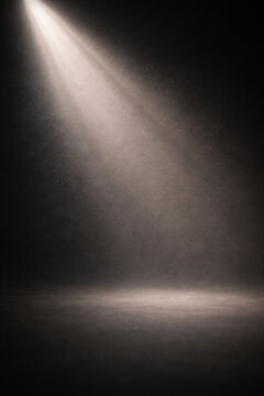 A single beam of light illuminates a dark, dusty stage, creating a dramatic and mysterious atmosphere.