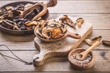 Pieces of dried mushrooms in bowl, preserving food