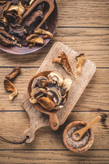 Pieces of dried mushrooms in bowl, preserving food