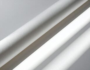 Obraz premium Close-up view of white cylindrical objects with gray background