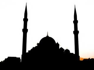 Silhouette of a mosque at sunset
