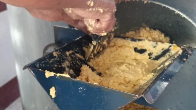 Traditional Milling Process of Yellow Corn into Masa Dough using Nixtamal Grinder