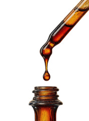 Amber liquid dripping from dropper into bottle