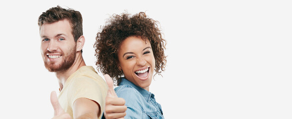 Thumbs up, banner and couple in studio with portrait, good job or thank you in okay hand gesture. Yes, interracial or people on white background with positive emoji, space or appreciation in feedback