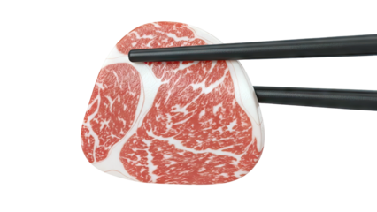 Chopsticks holding marbled Wagyu beef slice