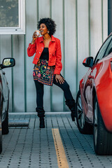 woman on the street drinking coffee
