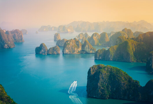 Majestic landscape of Halong bay at sunrise with limestone islands, travel landmark Vietnam