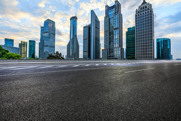 Empty asphalt road and modern city buildings with skyscraper in Shanghai