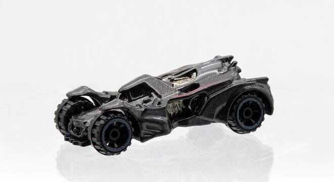 Bologna - Italy - January 5, 2026: Arkham Batmobile die-cast model by Hot Wheels isolated on white background.