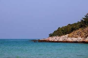 Cape green sea and blue sky background