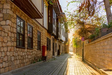 Fototapete Rund Enge Straßen Old Ottoman houses in the narrow streets of Antalya Old Town Kaleici district  © yalcinsonat