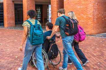 University students walking together with classmate in wheelchair