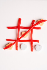 Candy Tic Tac Toe Game Made of Red Candy, Flat Lay