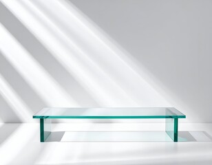 A glass platform bathed in stark light and shadow against a white backdrop