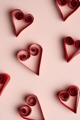 Heart Shaped Paper Pattern on Pink Background