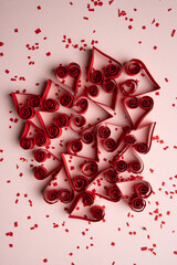 Scattered Heart Candy Sprinkles on Pink Background