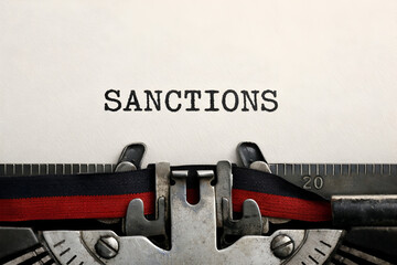 Sanctions typed on an old typewriter, concept of restrictions