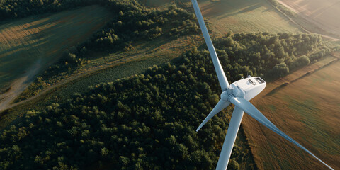 A bird's-eye view of a wind turbine, an eco-friendly source of energy, standing in a field
