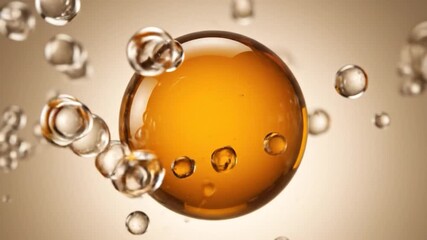 Amber liquid sphere surrounded by water bubbles - Powered by Adobe