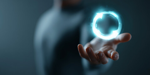 A person holding a glowing circular icon representing transformation and progress 