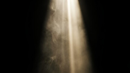 Dramatic spotlight beam through dust and fog on black