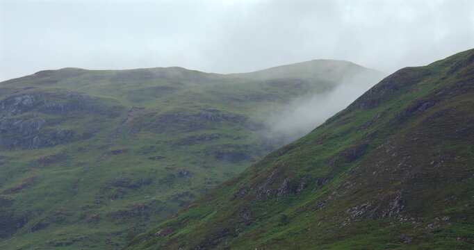 Time lapse Shot of clouds rolling behind hills at loch Etive at Bonawe Pier