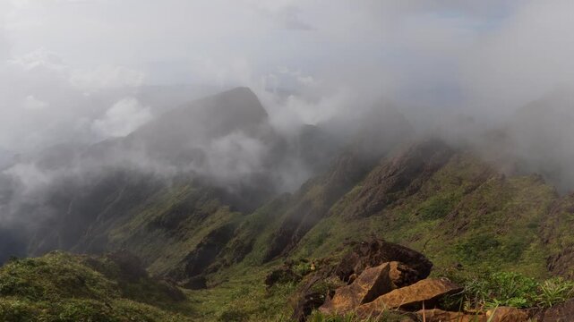 Misty mountain ridgeline along Mt Guiting Guiting trail with dense clouds and greenery, G2 Sibuyan Philippines