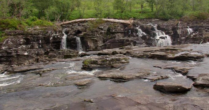 wide panning shot left to right looking down Stream of the river Orchy near Eas Urchaidh, The Falls of Orchy,