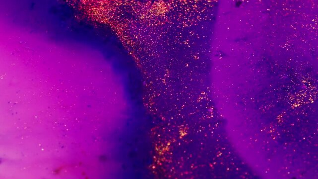 Vibrant macro shot of swirling ink mixing in water, creating abstract patterns